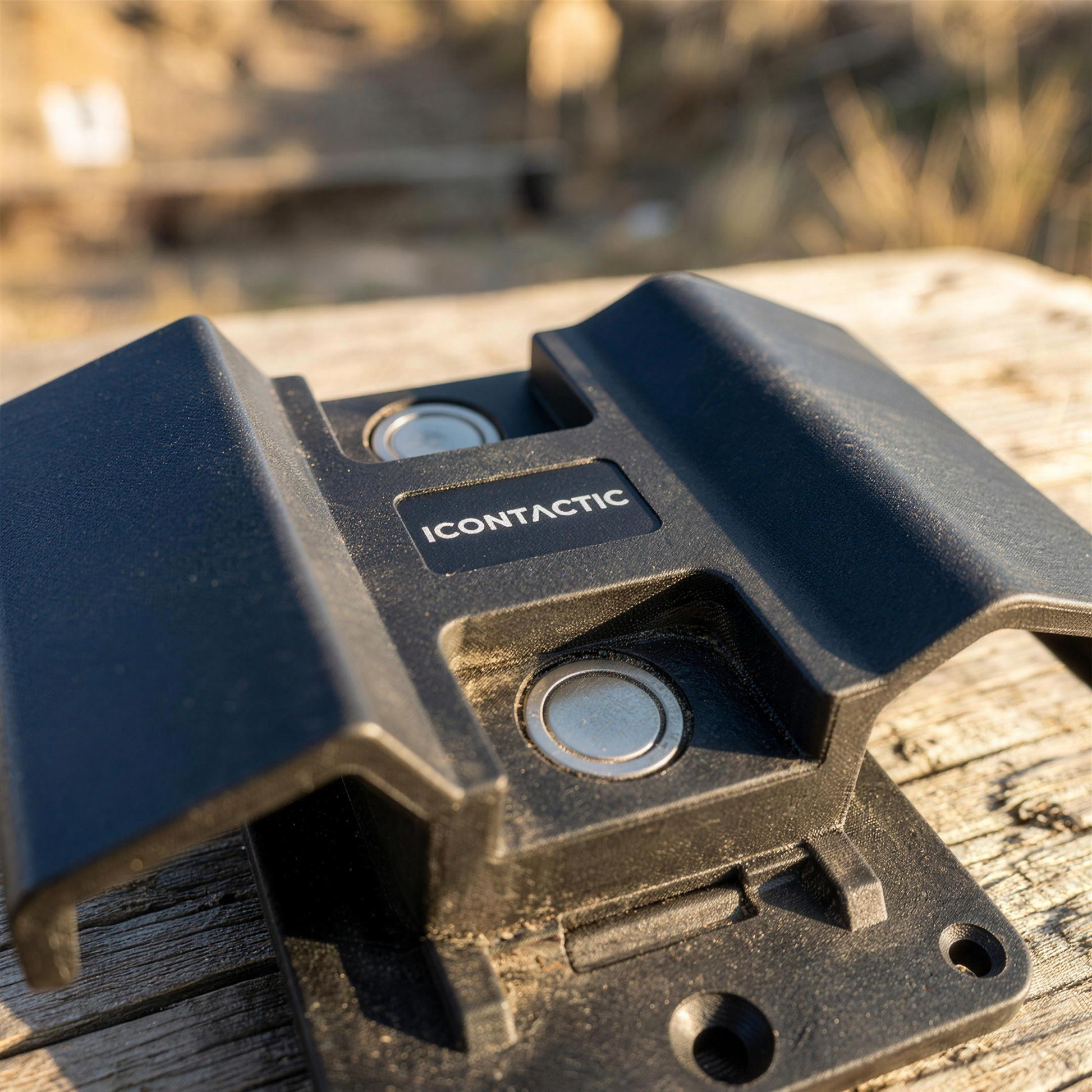 ICONTACTIC Magnetic Handgun Mount, concept render pending supplier verification, close-up of the ICONTACTIC label, magnets and trigger-guard wing, no firearm
