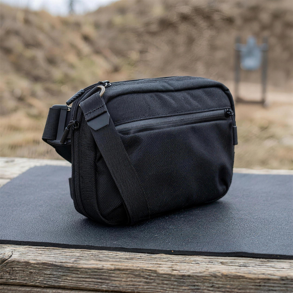 ICONTACTIC Full-Size Concealment Carry Bag, concept render pending supplier verification, bag only on an outdoor range bench