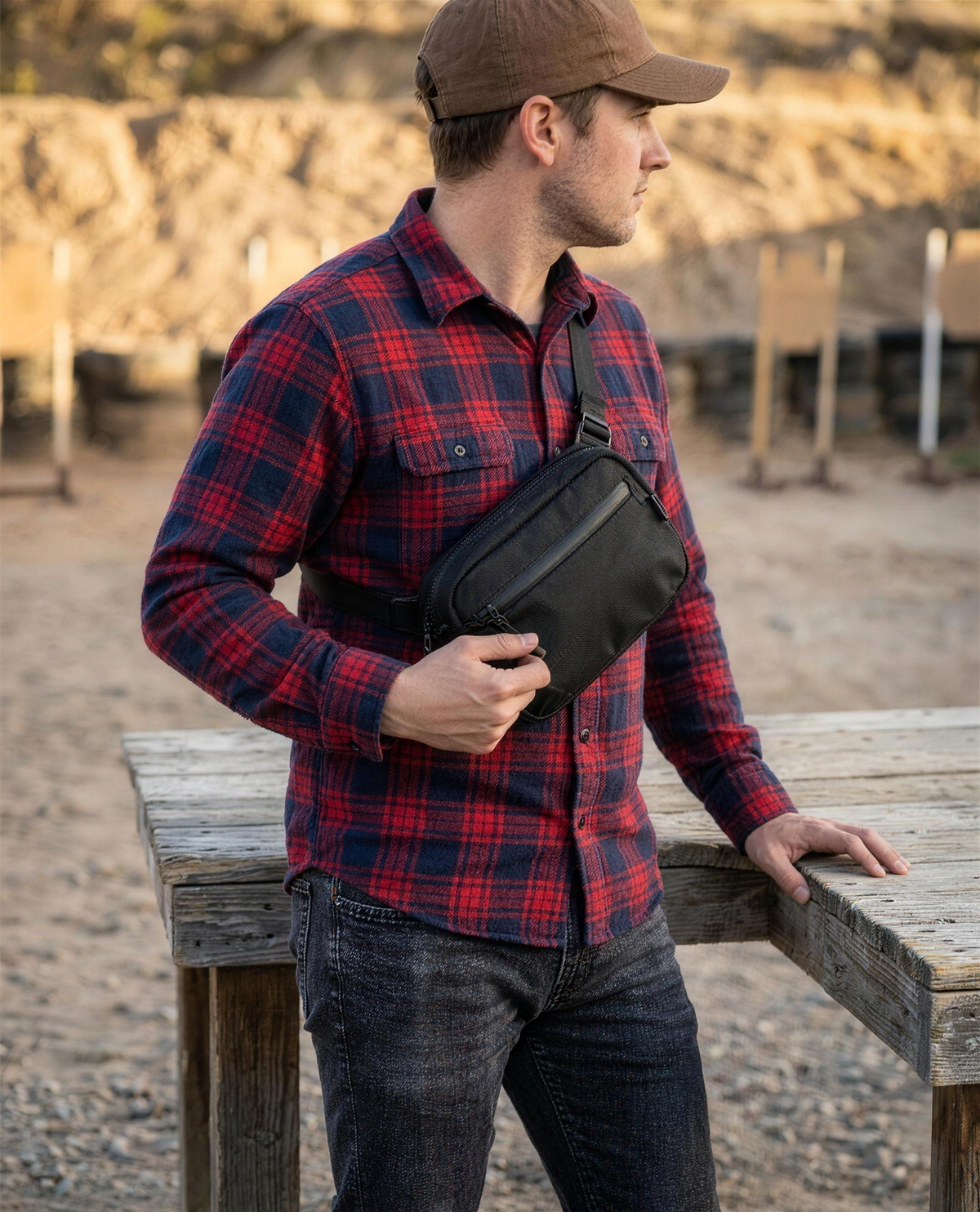 ICONTACTIC Full-Size Concealment Carry Bag, concept render pending supplier verification, worn closed at an outdoor shooting range, illustrative