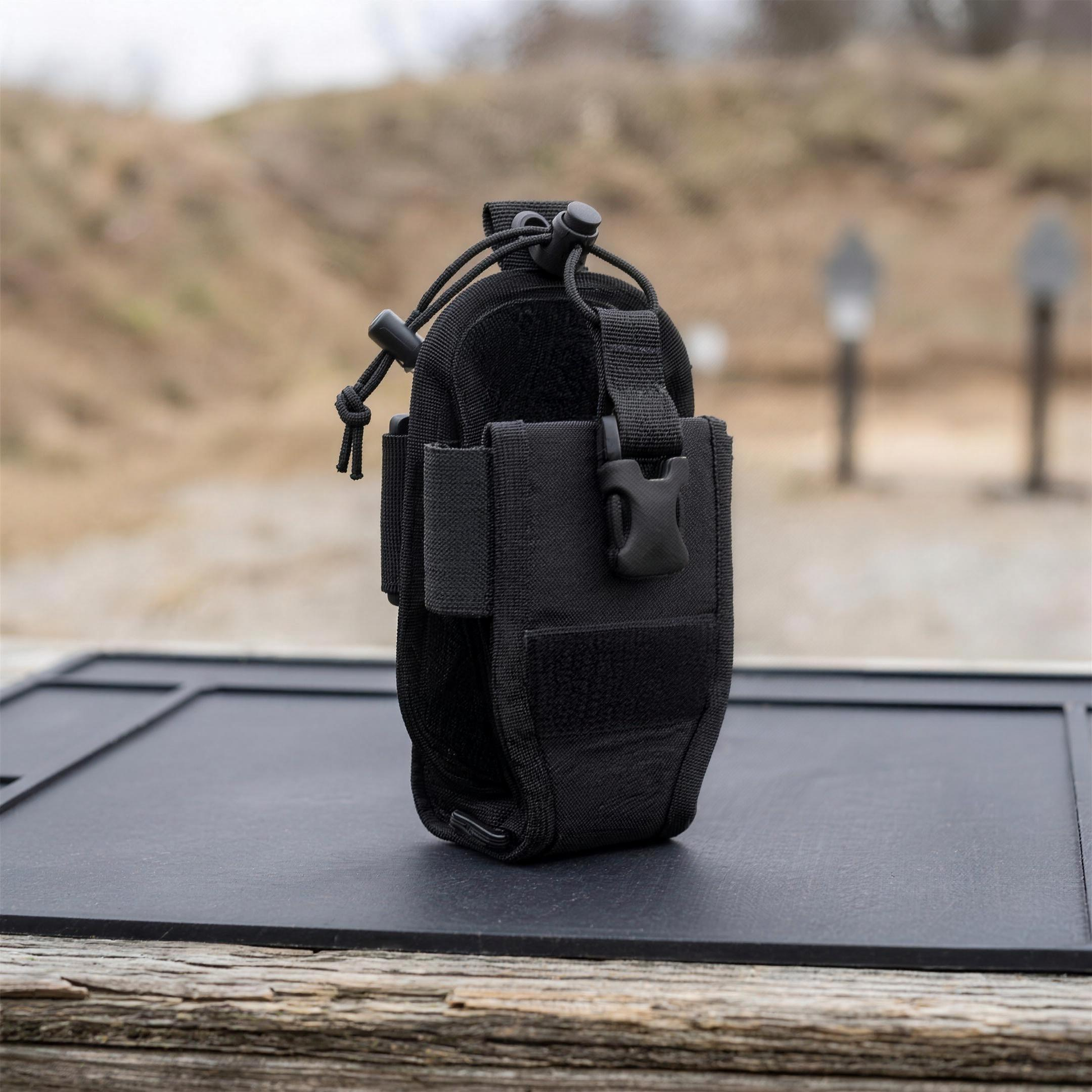 ICONTACTIC Adjustable Radio Carrier, concept render pending supplier verification, shown empty on an outdoor range bench