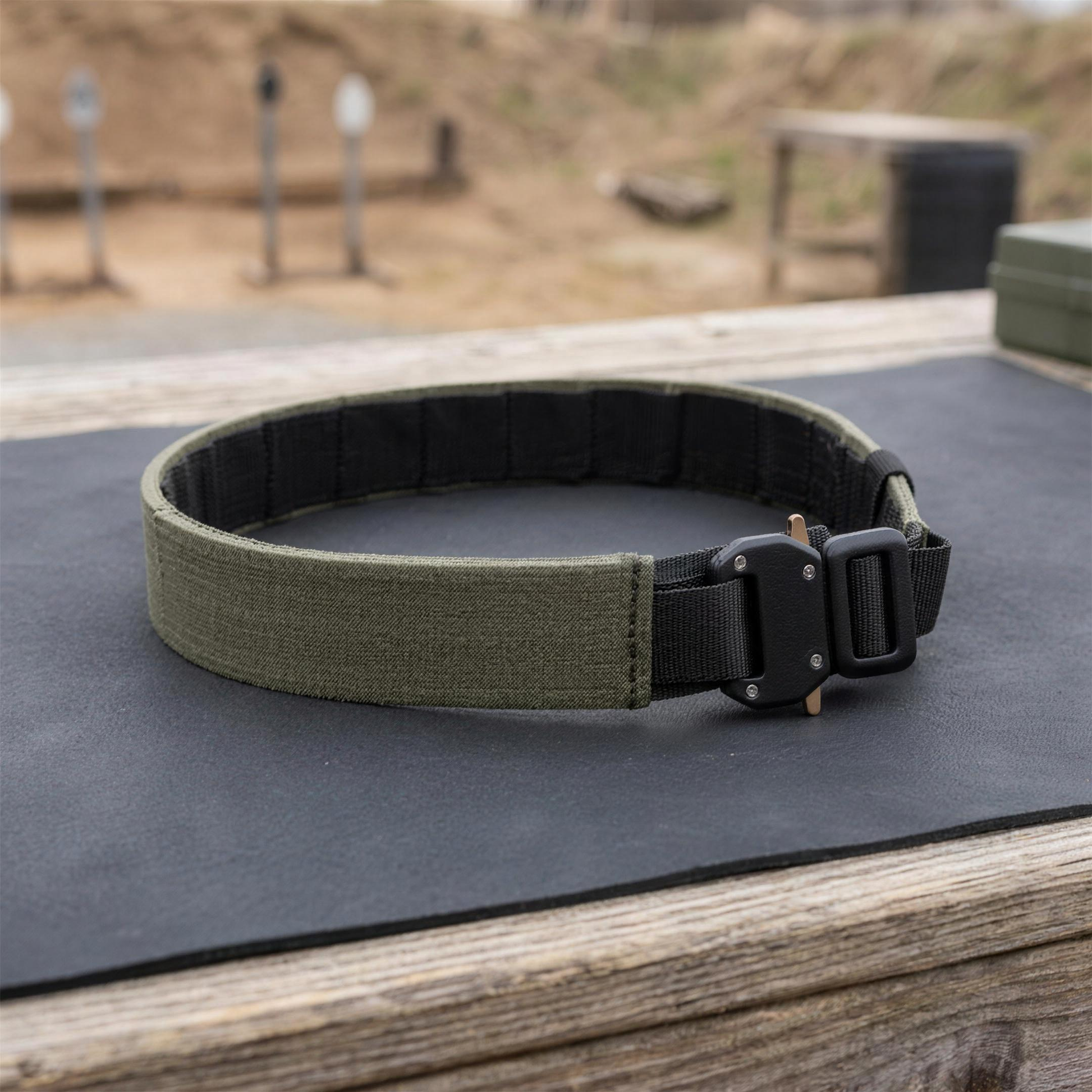 ICONTACTIC 1.75 inch Outer Equipment Belt, concept render pending supplier verification, coiled belt on an outdoor range bench