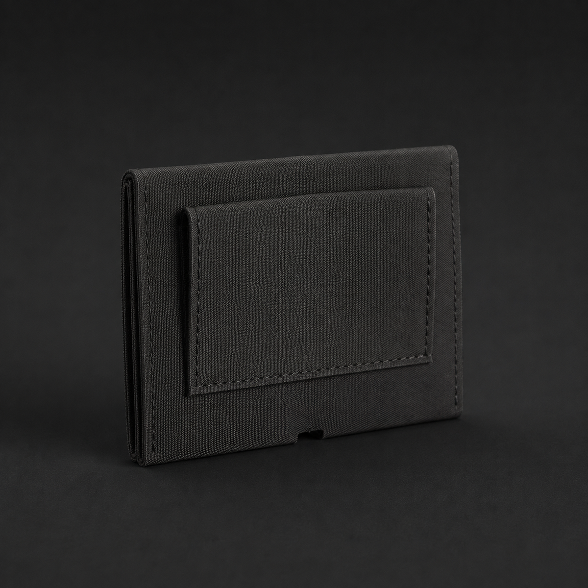 ICONTACTIC Low-Profile Double Magazine Pouch, concept render pending supplier verification, rear view showing the belt passthrough on graphite