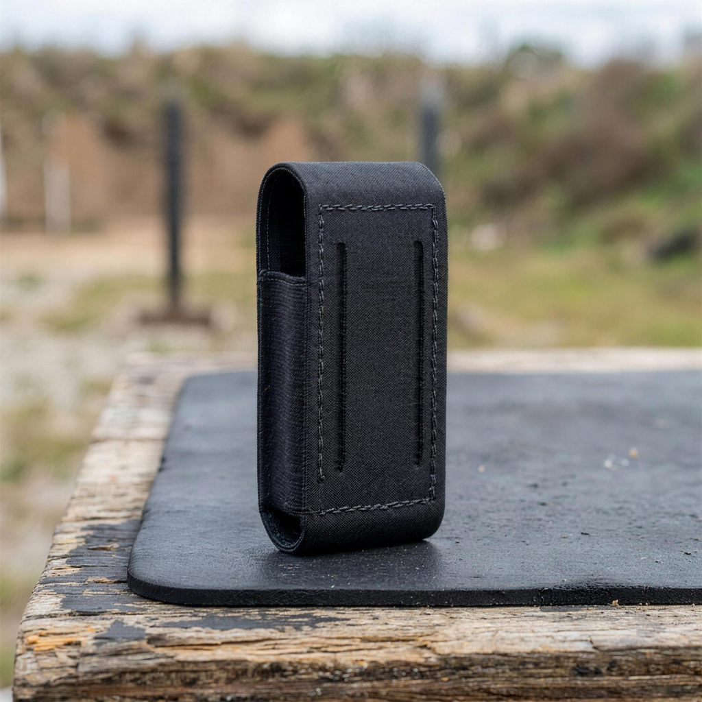 ICONTACTIC Low-Profile Single Magazine Pouch, concept render pending supplier verification, empty pouch on an outdoor range bench