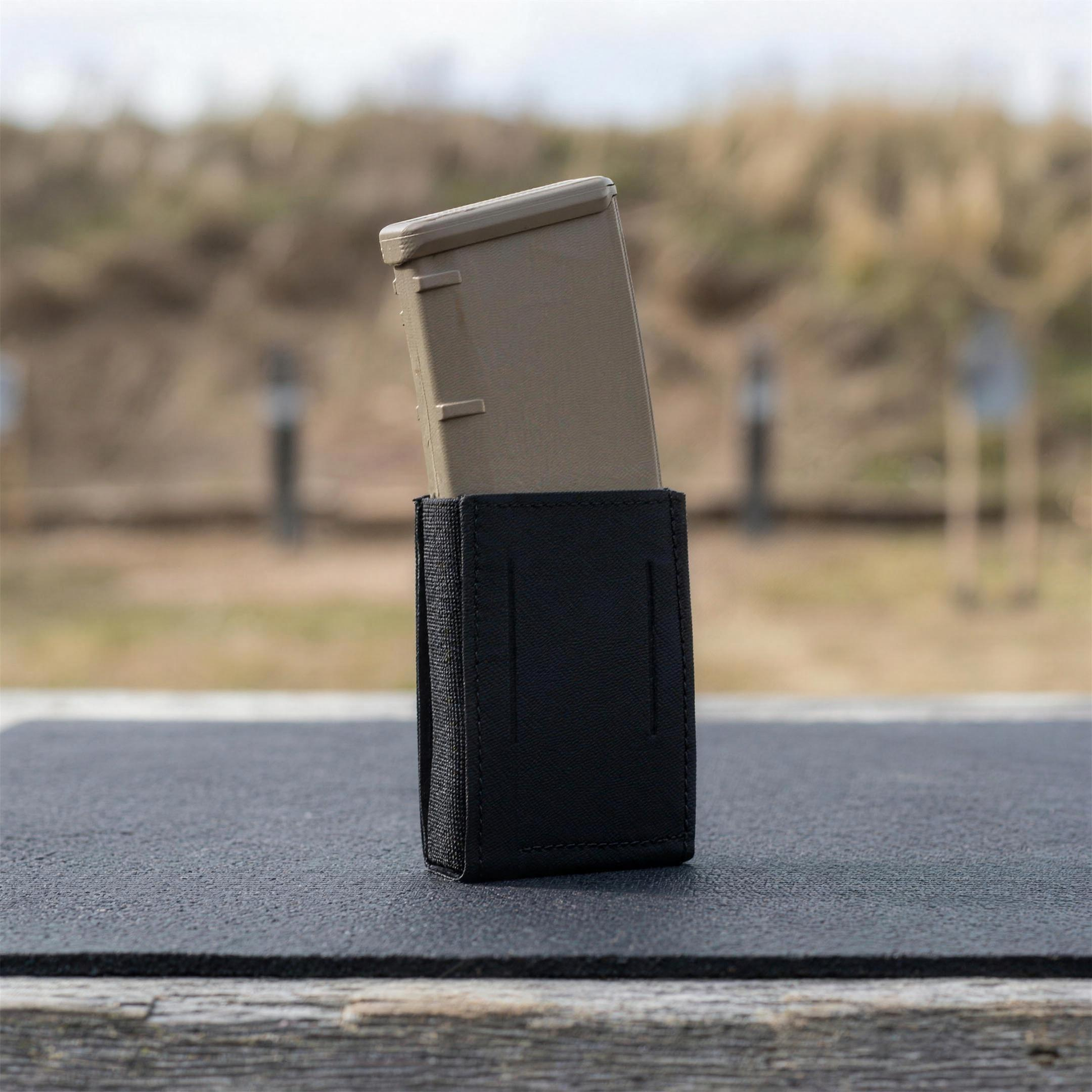 ICONTACTIC Low-Profile Rifle Magazine Pouch, concept render pending supplier verification, pouch with one rifle magazine on an outdoor range bench