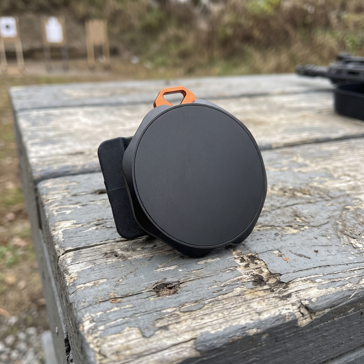 Close-up of the Magnetic Phone Mount magnetic face, bevelled edge and orange lanyard tab