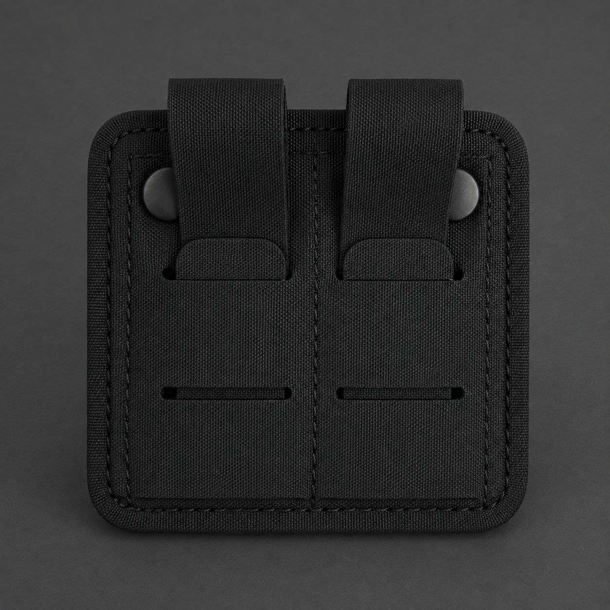 ICONTACTIC Magnetic Retention Catch, concept render pending supplier verification, rear view showing the two snap straps and weave slots on graphite