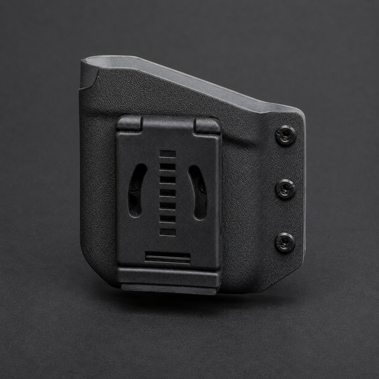 ICONTACTIC Belt-Clip Phone Sheath, concept render pending supplier verification, rear view showing the belt clip and three screws on graphite